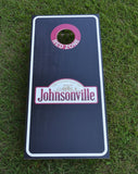 Johnsonville branded cornhole board on grass