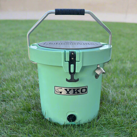 Mint green cooler with YKO logo on grass