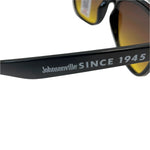 Sunglasses with 'Johnsonville Since 1945' branding on a light background