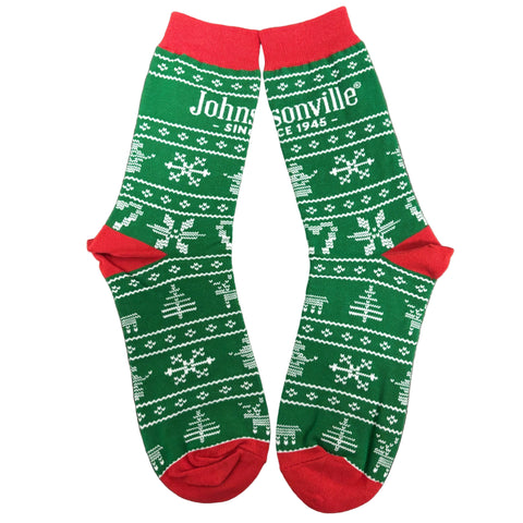 Green socks with red accents and Johnsonville logo on a wooden surface